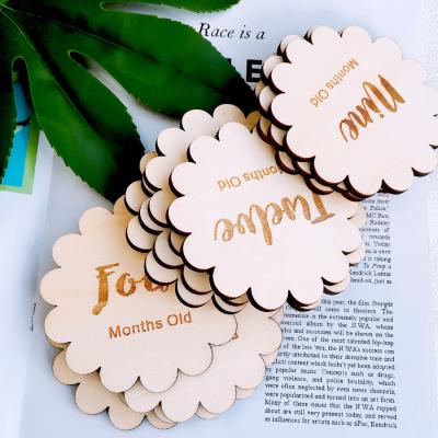 China China Baby Months Flower Milestone Cards Wooden Plaques , Laser Cut Circle Baby Monthly Milestone for sale