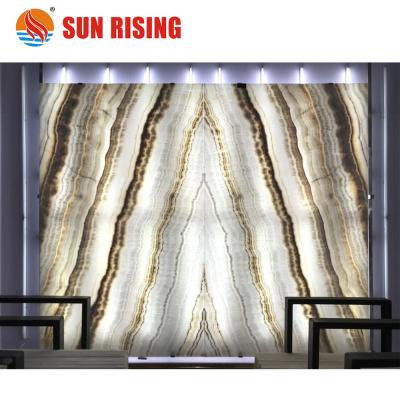 China Book Match Acid Resistant White Onyx Wood Slab For Decoration for sale