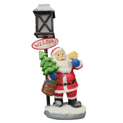 China Hot Sale Resin Santa Claus Art Christmas Statue With Lantern Light Stake For Christmas Decoration And Gifts for sale