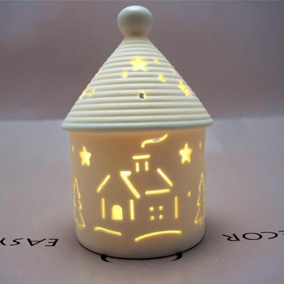 China Ceramic Round Hollow Christmas House Led Lampwork Ornament for sale