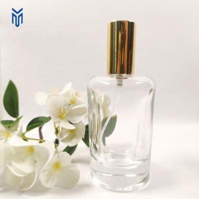 China Cosmetic luxury 50ml perfume round glass bottle perfume refillable spray bottle with gold ground cap for sale