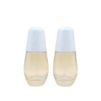 China Cosmetic Factory Spot 30ml clear press pump button Small Bulb Dropper Serum Essence Bottle for sale