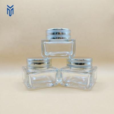 China Cosmetic Luxury 40g square cosmetic Eye Cream Glass Jar Face Cream Containers with gold ABS lid for sale