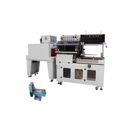 China Automatic CLOTHING Rigid Wrap Machine Starburst Wrapping Shrink Packing Machine Wrap Machine for sale