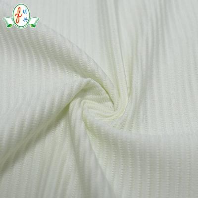 China Stretch Solid Dyed White Stripe Spandex Jacquard Cotton Seersucker Fabric Nylon Swimwear for sale