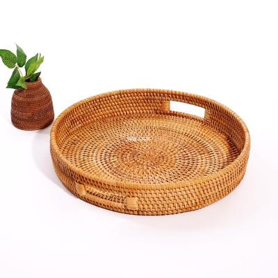 China Sustainable Natural rattan woven basket round serving tray with handles coffee table tray hand woven storage basket for wedding for sale