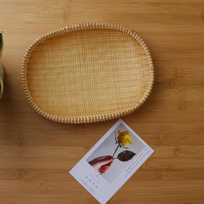 China Sustainable Hand woven oval bamboo flat basket food serving tray for sale