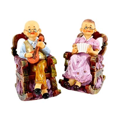 China Wholesale China A Pairs Old Pairs Bedroom Resin Rocking Chair Gift Couples Statues Sleep Garden Ornament for sale