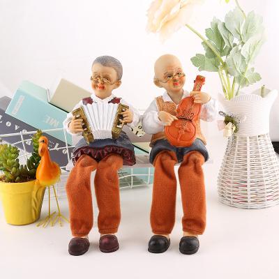 China European China Resin Crafts Hanging Feet Elder Couple Gift Custom Ornaments Bedroom Home Decoration for sale