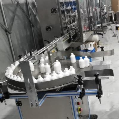 China Hotels bottle feeder, conveyor, unscrambler, bottle rotary table automatic bottle filling line for sale