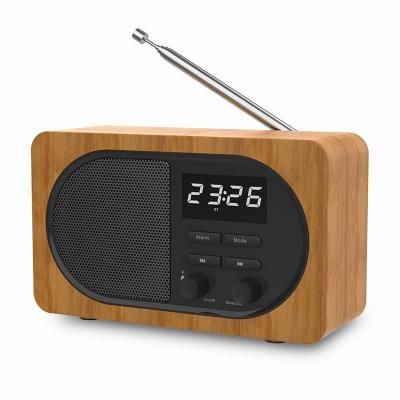 China Video Call Classic Style Radio Still Form FM Radio Alarm Clock Mini Wooden Wireless Speaker for sale