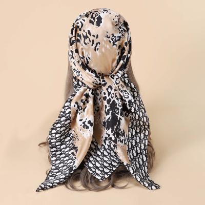 China Hand printing 2022 summer new 90CM silk chiffon imitation satin large square scarf women's shawl beach scarf temperament wholesale for sale