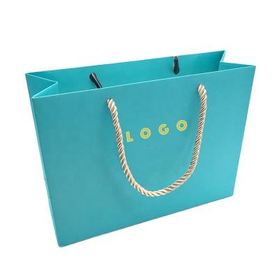 China Recyclable Luxury Blue Paper Bag With Logo For Clothing Jewelry Shopping Gift Packaging for sale