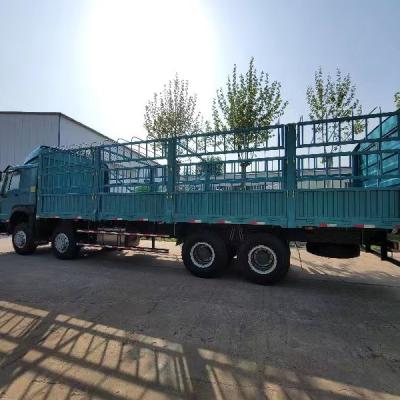 China SINOTRUK HOWO low price WP12.400E201 Engine 10 wheel fence cargo trucks in ghana 103500x2550x3450mm for sale