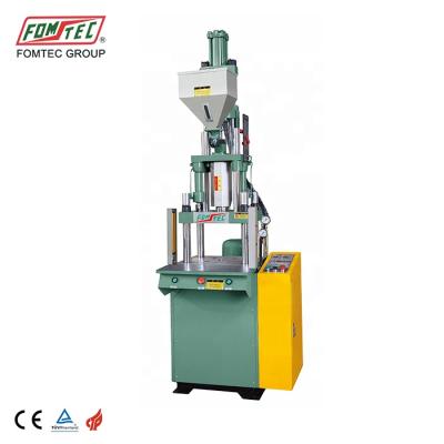 China FOMTEC VERTICAL Standard Vertical Injection Molding Machine 200 kN Mini Plastic Injection Machine for sale