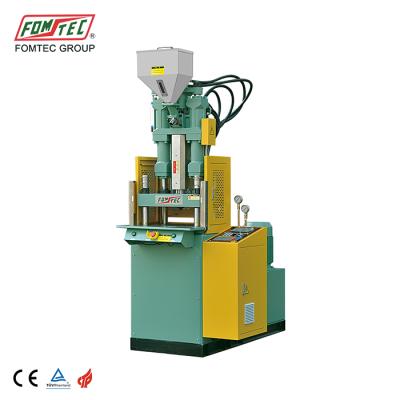 China VERTICAL 600 kN automatic injection table top standard injection machine mini vertical plastic injection molding machine for sale