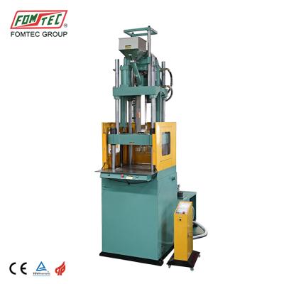 China VERTICAL 2200 kN single table plastic injection machine vertical shuttle injection molding machine for sale