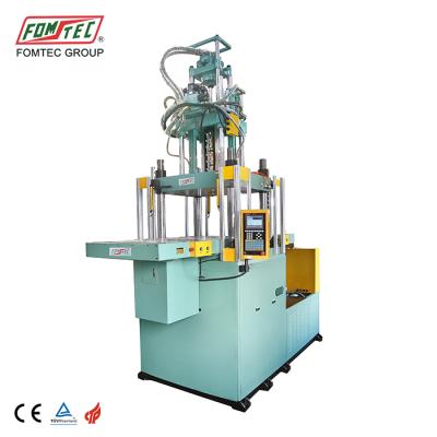 China VERTICAL 2200 kN double slip table injection molding machine plastic vertical injection molding machine plastic food container making machine for sale