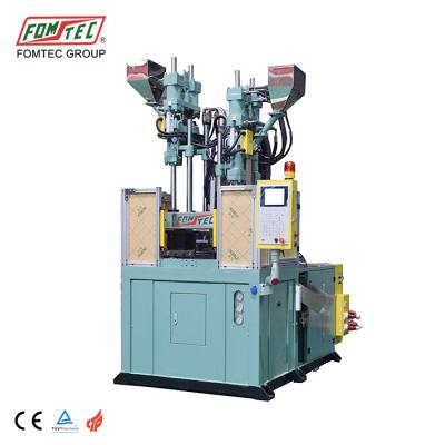 China VERTICAL 120TON 160TON hot sales vertical plastic injection molding machine for handle phone cover plastic machine for sale