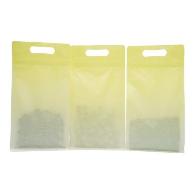 China Custom Logo Assorted Sizes Double-Sided Glossy Custom Recyclable Clear Plastic Packaging Bags Gusset Base Handle Seal Bags With Hand Hole for sale