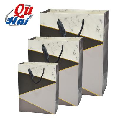 China Recycled Materials Wholesale Paper Bag Boutique Gift Luxury Black Marble Packaging Bag Small Shopping Paper Bags Foil Ribbon for sale