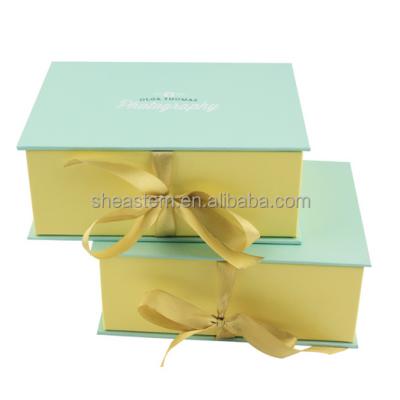 China Handmade customized cardboard packing box. Book shaped boxes with ribbon for sale