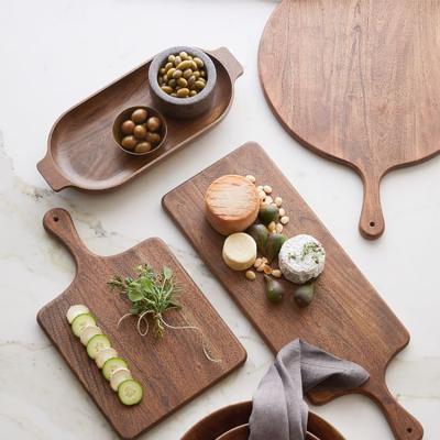 China Durable Chinese Customize Round Wooden Steak Pizza Serving Boards Wooden Dish With Handle for sale