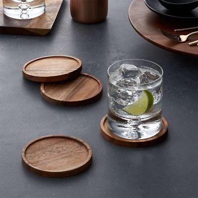 China 4 Sets Printing Tea Cup Sustainable Natural Round Paddle Natural Acacia Wooden Coaster For Drinks for sale