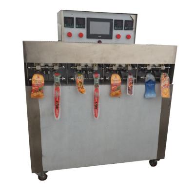 China New Automatic 8 Heads Food Stainless Steel Chocolate Stick Water Juice Inflatable Bag Filling Machine for sale