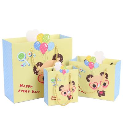 China Durable Customized White Cardboard Paper Bags With Handles Printed Cartoon Animal Kraft Paper Package Bags for sale