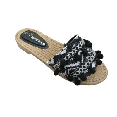 China Popular Insulative Straw Slippers Thailand Logo Rattan Braided Badminton Tassels Shoes Beach Ethnic Holiday Slippers for sale