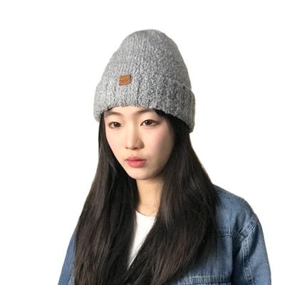 China Casual Wholesale New Women's Warm Knitted Hats Adult Brimless Hats Wholesale Neutral Thick Winter Knitted Hats for sale