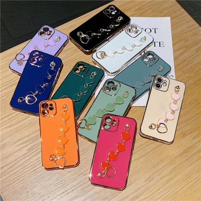 China INS Girl Back Cover Heart Shockproof Bracelet Love Electroplating TPU Case For iPhone 11 12 13 14 pro Max Phone Case With Chain for sale