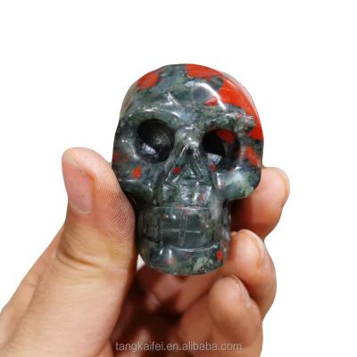 China China Wholesale Dragon Blood Stone Natural Stone Carved Skulls African Blood Stone Crafts for sale