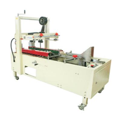 China Perfectly Performing Semi Automatic Milk Carton Sealer Box Tapping Machine for sale