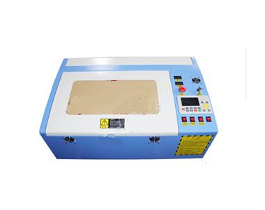 China Plastic Rubber Leather Cloth Engraving Cutting 40-50W 300X400mm CO2 Laser Engraving Machine for sale