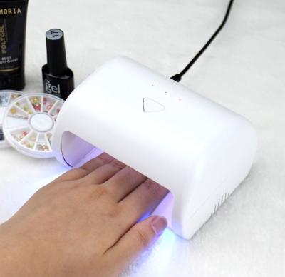 China Art Beauty Jinyi Hot Sale Mini Portable Smart Phototherapy Dual Light Source Nail Lamp UV Led Dryer for sale