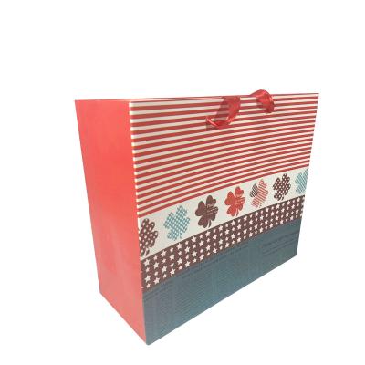 China QZH Disposable Cheap Paper Shopping Bag Custom Paper Bags With Ribbon Handle for sale