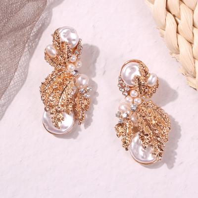 China Romantic Gold Plated Leaf Shape Pearl Statement Earrings For Women for sale