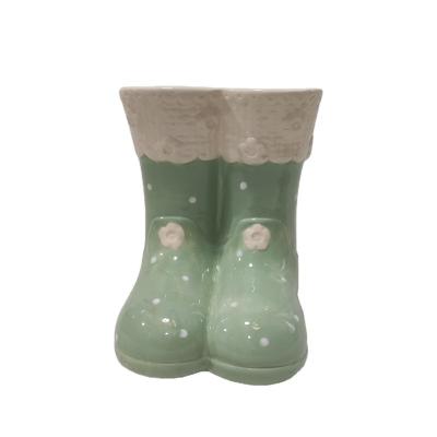 China Plants Flower Novelty Ceramic Snow Boot Green Planter Indoor And Outdoor Pots For Garden Decoration for sale