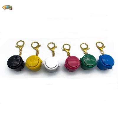 China Crane machine spare parts game accessories plastic console round knob professional game key chain for sale