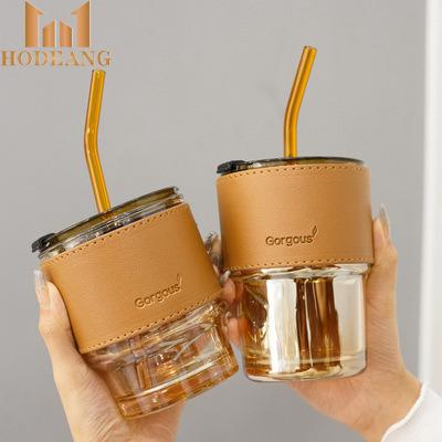 China Sustainable Creative Glass Portable Leather Cups Leather Sleeve Coffee Mug With Lid And Straw for sale