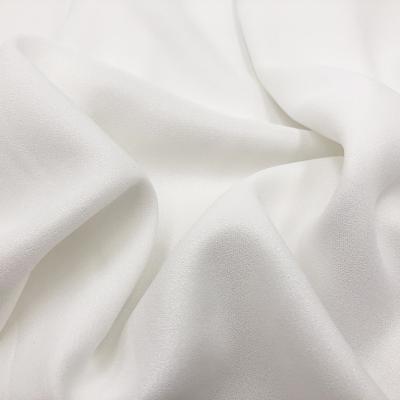 China White Silvery 100% Stretch Soft Polyester Shirt Yarn Fabric Women Pants Dress Polyester Chiffon Fabric For Garment for sale