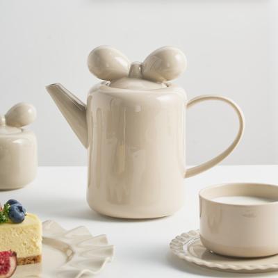 China Viable European Nordic Tea Use Afternoon Coffee Teapot Large Bowknot Lid Clay Ceramic Teapot for sale