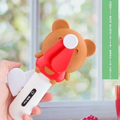 China Hand Press Fan Children's Neck Hanging Cartoon Mini Hand Press Fan Pig Bear Rabbit Mini Portable Press Fan zu verkaufen