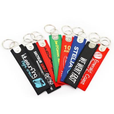 China Promotional Gift Promotion Style Insert Flight Embroidered Key Chain High Quality Custom Embroidery Key Chain en venta