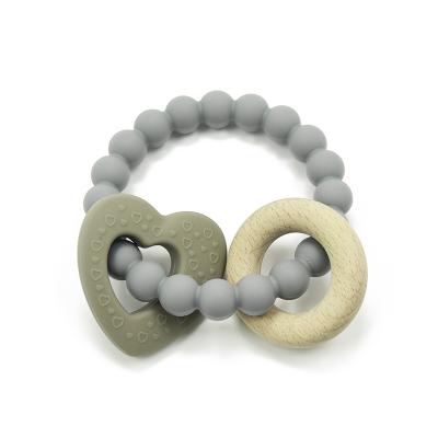 China New Arrival 100% Non-Toxic Silicone Silicone Food Grade Beech Wood Teether Organic Non-Toxic Sensory Toy Bracelet Baby Silicone Teether for sale