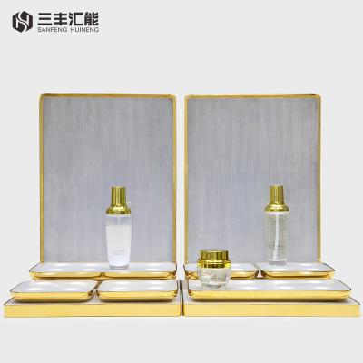 China 2022 Luxury OEM/ODM Customized Effect Luxury Metal Illumination LED Cosmetic Display Stand for sale