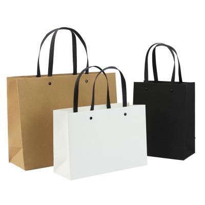 China In Stock Eco-friendly Garment Rivet Kraft Paper Custom Advertising Handbag High Quality Gift In Stock Paper Shopping Bag for sale