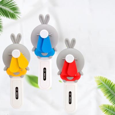 China 2020 new summer handheld blade electric fan spal outdoor wholesale cartoon small mini plastic portable fan gift toy fan for sale